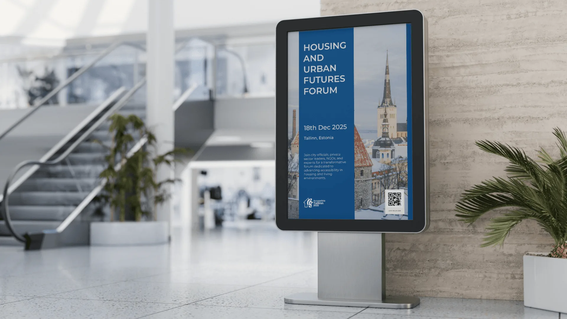 A digital poster for the Housing and Urban Futures Forum in a building lobby